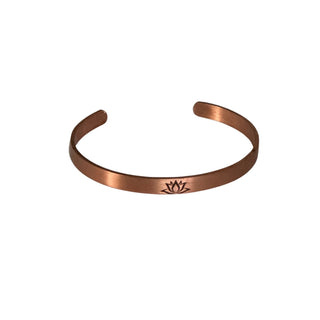 Copper bracelet with a symbol on a white background