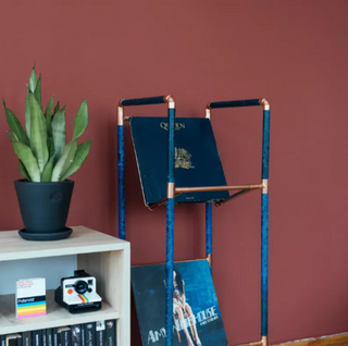 Recycled copper record stand with vintage-inspired verdigris finish, perfect for living rooms or music studios.