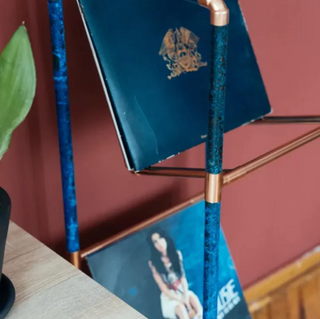 Side view of the handcrafted copper vinyl record stand showcasing its sleek and durable design.