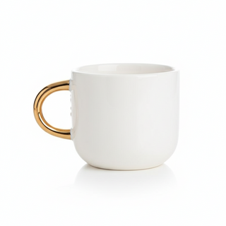 White mug with a gold handle on a white background
