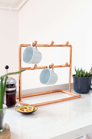 Copper Cup Stand – Industrial Display with Artisanal Charm